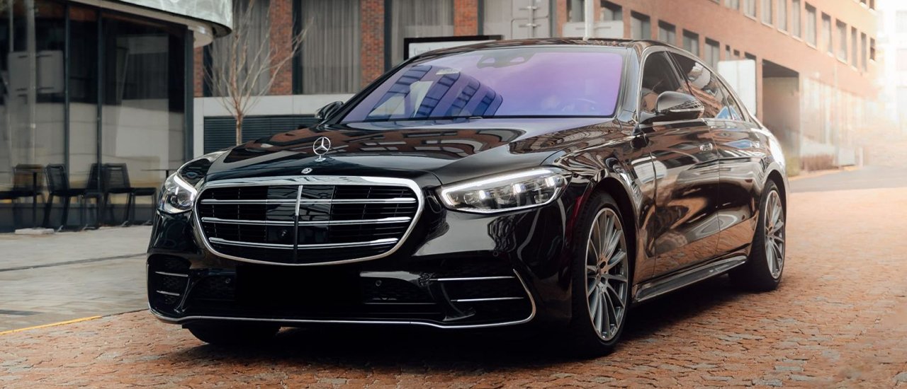 Stylish Mercedes-Benz S-Class parked on a London city street, exuding elegance and performance with a sleek black exterior.